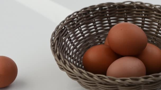 Closeup Video Basket Bround Organic Chicken Eggs White Background — Stock Video