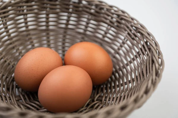 Closeup Fresh Brown Eggs Easter Basket White Background — Stock Photo, Image