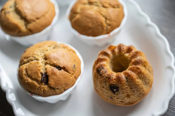 Yummy Baked Muffins Chocolate Pieces White Plate — Stok fotoğraf