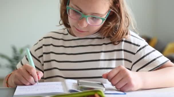 Pretty Teenage Girl Sitting Desk Making Homework Writing Her Exercises — Stockvideo