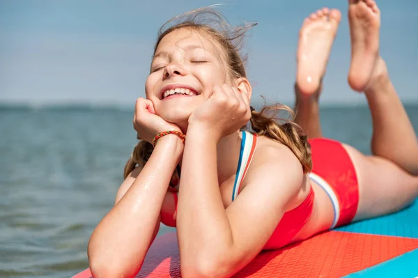 Dreaming Teen Girl Lying Stand Paddle Board Closed Eyes Enjoy — Zdjęcie stockowe