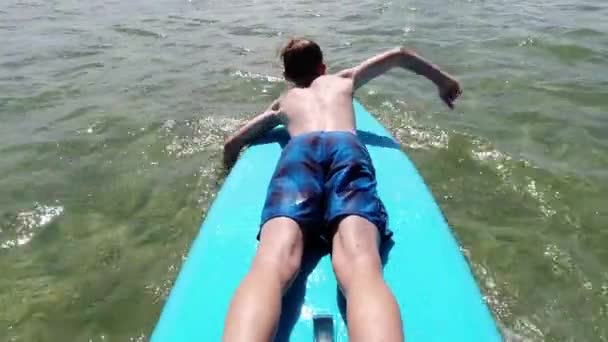 Handsome Teen Boy Lying Swim Sup Board Sea Summer Vacationsummer — Video Stock