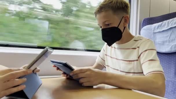 Teen Boy Medical Mask Sitting Train Tablet Travelling — Wideo stockowe