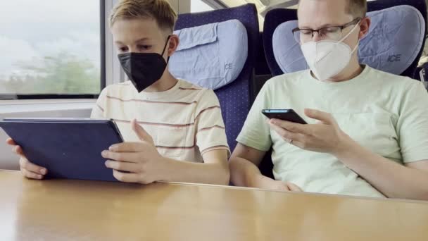 Father His Teen Son Traveling Train Using Cellphone Tablet Vocation — Stock Video