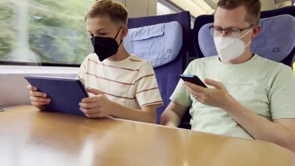 Father His Teen Son Traveling Train Using Cellphone Tablet Vocation — Stock Video