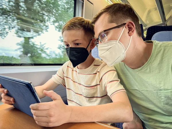 Teen Son His Father Travelling Railroad Watching Movie Tablet — Stock fotografie