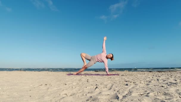 Slow Motion Video Girl Doing Morning Yoga Routine Beach Baltic — Stockvideo