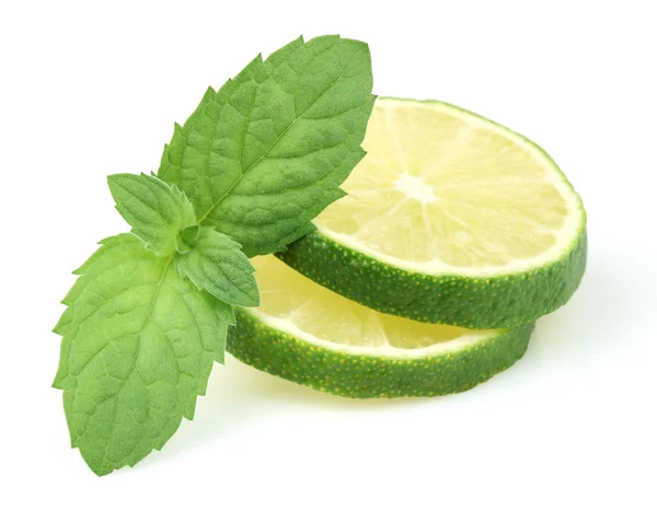 Slices of lime with mint — Stock Photo, Image