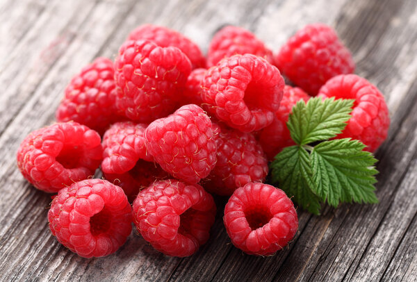 Ripe raspberry with leaf