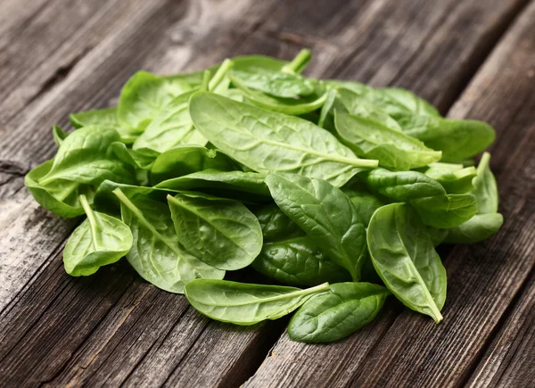 Spinach on a wooden background — Stock Photo, Image