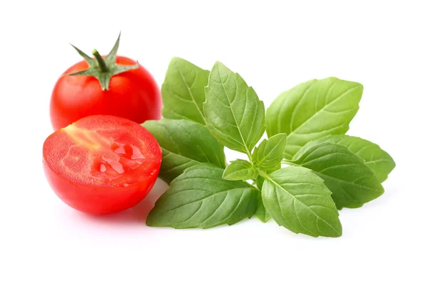 Tomato with basil Stock Photo