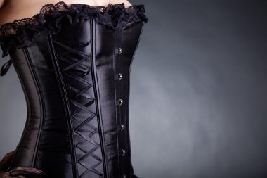 Close-up shot of a woman in black corset clipart