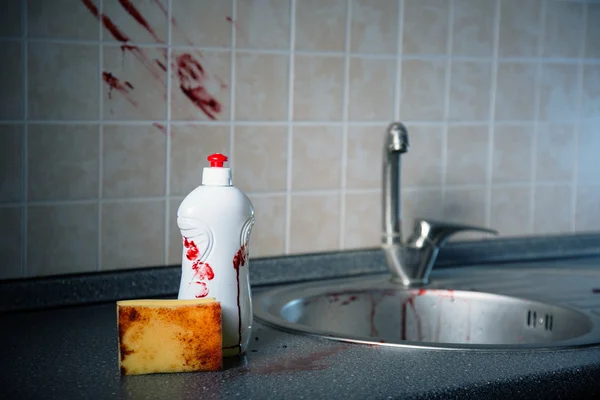 Bottle of dishwashing liquid with bloody fingerprints — Stock Photo, Image