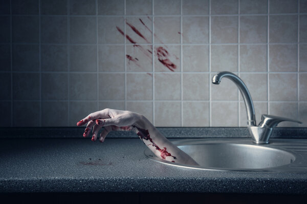 Bloody hand in kitchen sink