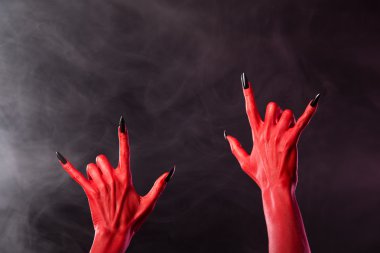 Red devil hands showing heavy metal gesture clipart