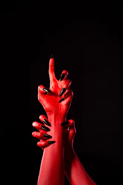 Scary red demonic hands with black nails, real body-art — Stock Photo, Image