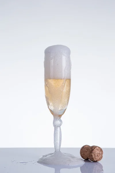 Elegant champagne glass and cork — Stock Photo, Image