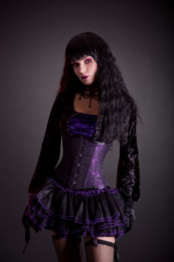 Gothic girl in purple and black outfit 