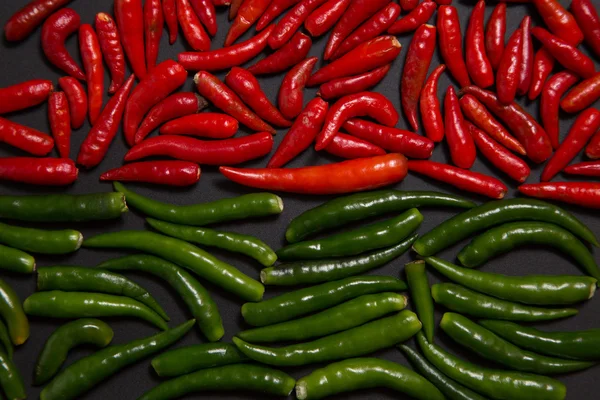 Texture of non-stem red and green bird eye chili pepper — Stock Photo, Image