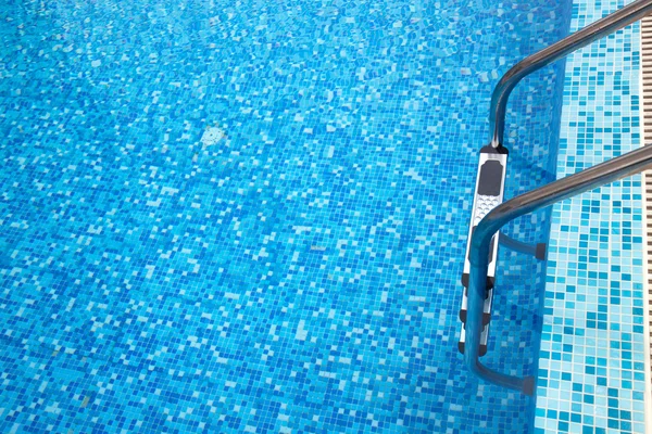 Part of swimming pool with ladder — Stock Photo, Image