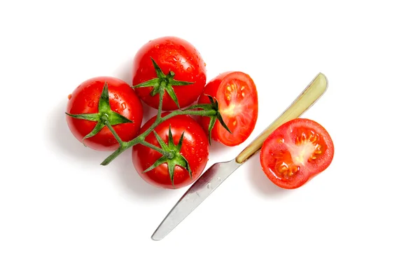 Top view of bunch of fresh tomatoes and knife — Stock Photo, Image