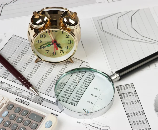 gold clock and office supplies