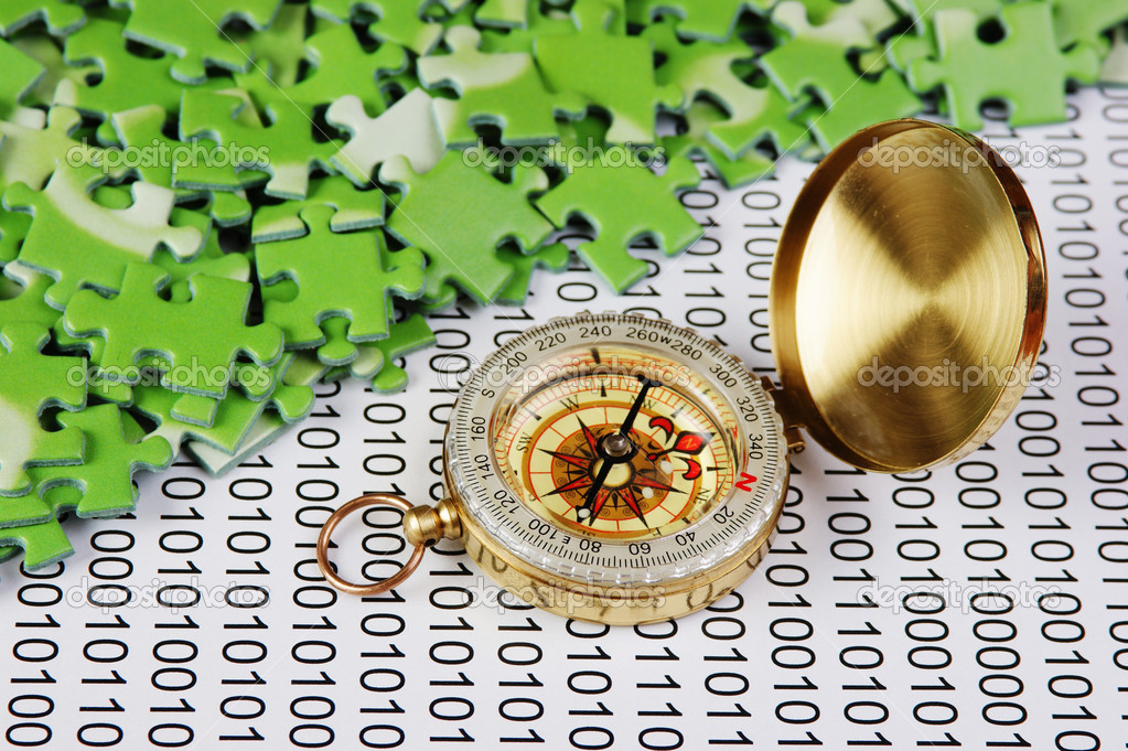 Puzzles and compass on a binary code — Stock Photo © Observer 33479325