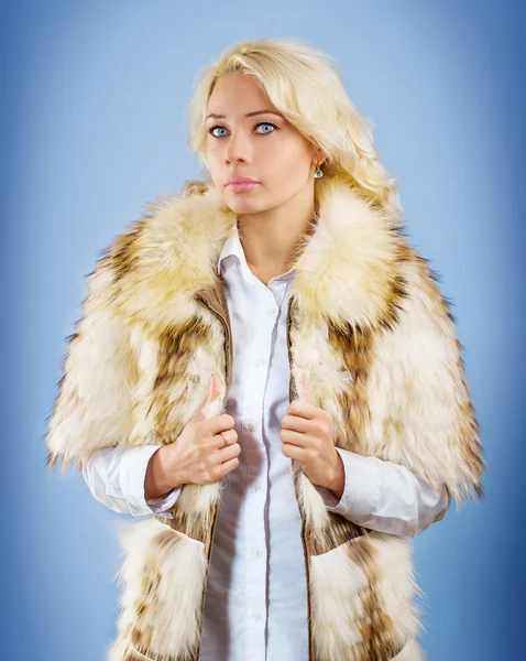 A young girl in fur wear — Stock Photo, Image