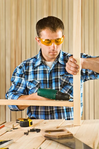 Young men works with screwdriver Royalty Free Stock Images