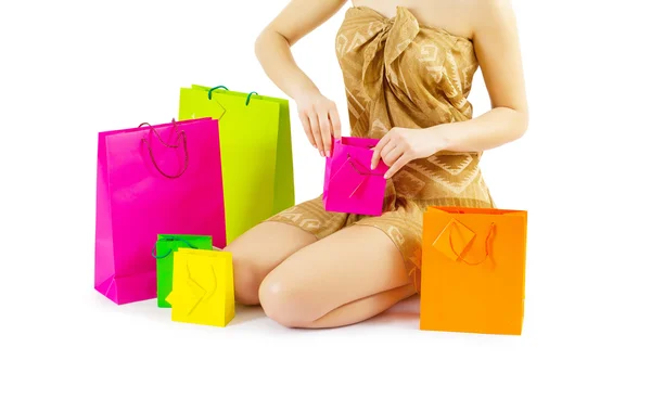 A girl loking in paper bags — Stock Photo, Image