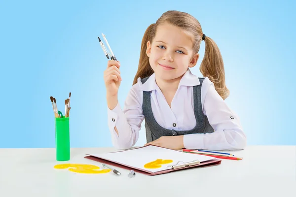 A little girl at shool table — Stock Photo, Image