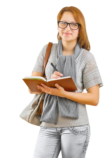 Hipster girl writing in notepad — Stock Photo, Image