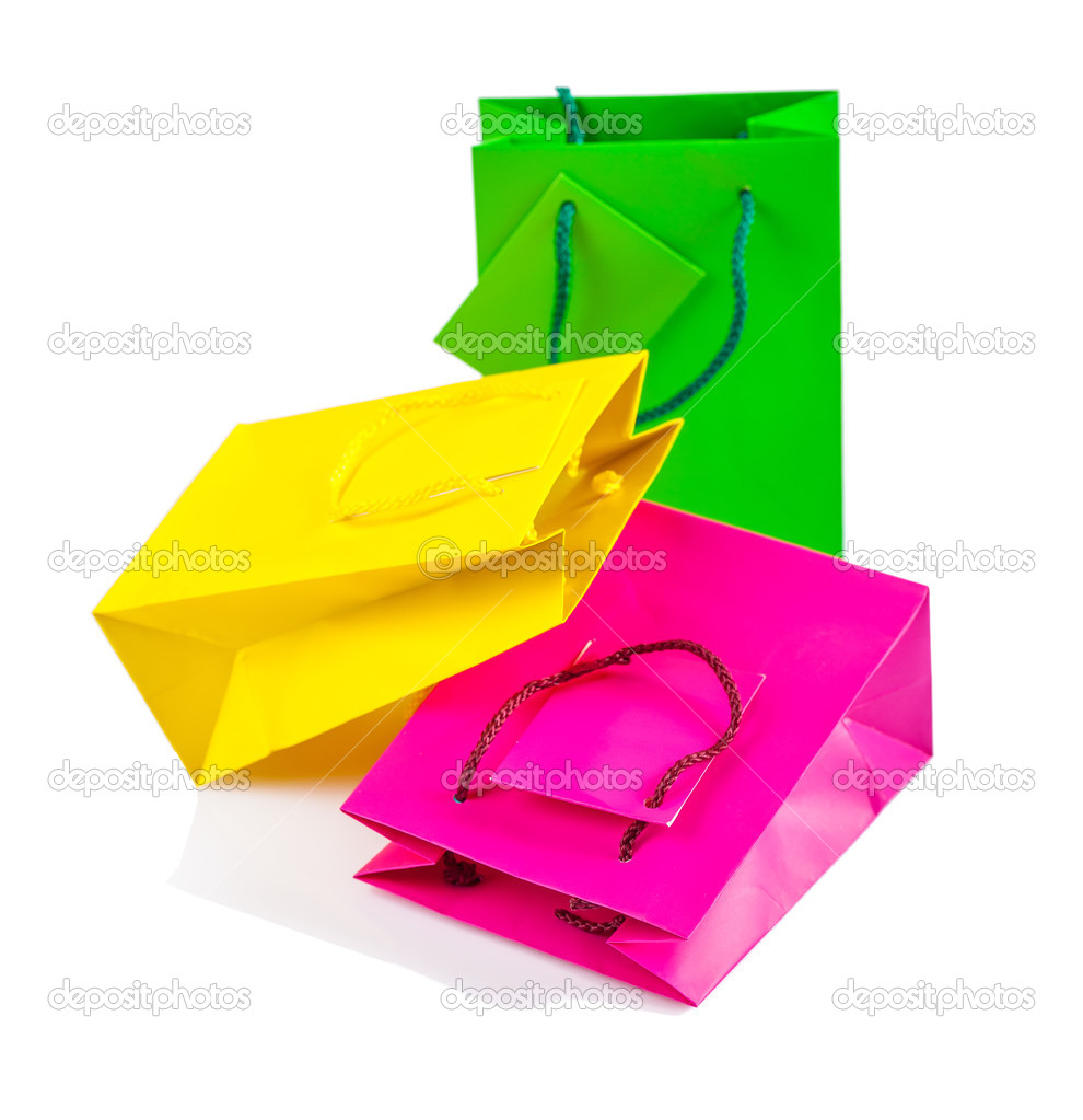 three clored paper bags isolated