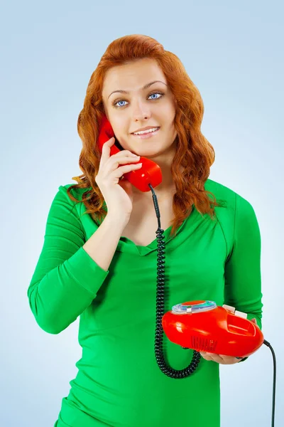 A young female with red telephone — Stock Photo, Image