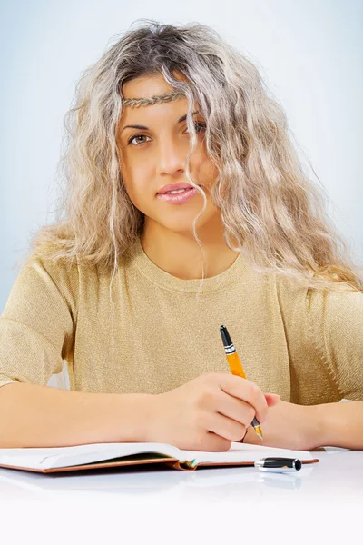 Beautyful young female with ballpoint pen — Stock Photo, Image