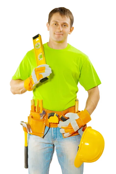 Worker in green t-shirt with tools — Stock fotografie