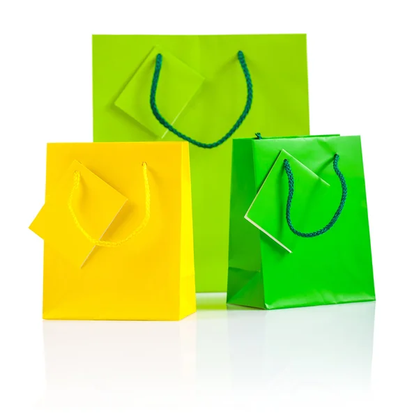 Three colored paper bags isolated on white — Stock Photo, Image