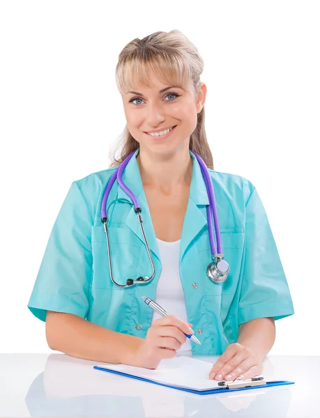 Medico femminile al tavolo bianco — Foto Stock