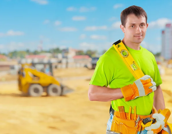 Trabalhador segurando lewel construção — Fotografia de Stock