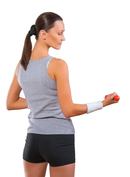 A sportswoman holding small dumbbell — Stock Photo, Image