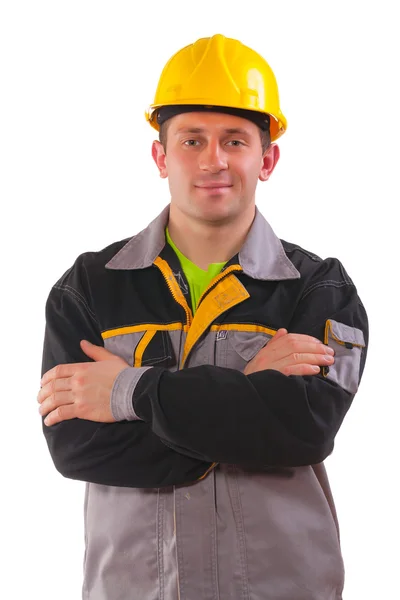 Młody pracownik z skrzyżowanymi rękami — Zdjęcie stockowe