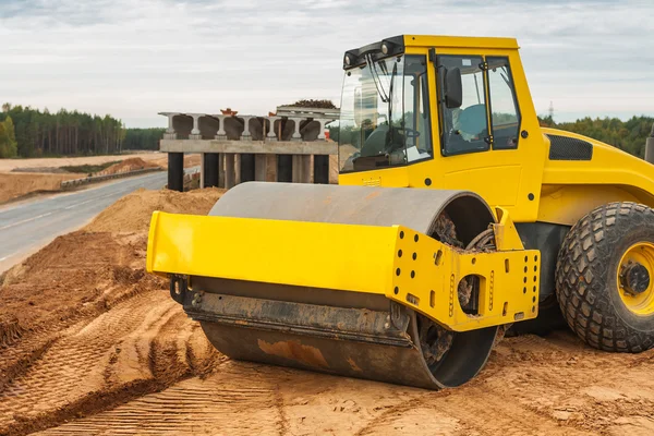 Sand compactor on pile of sand — Stock Photo, Image