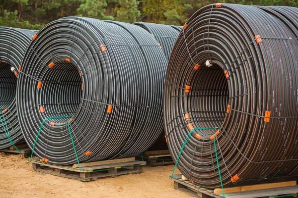 Rolls of pipes on construction site — Stock Photo, Image