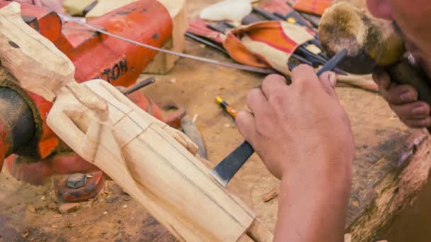 SIEM REAP, CAMBODIA - CIRCA DEC 2013: Making wooden figurine - the initial stages of work — Stock Video