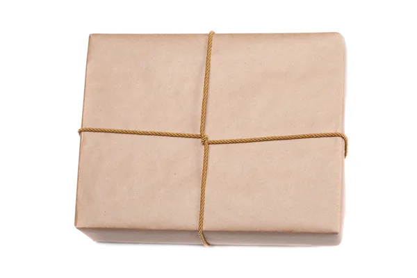 Parcel wrapped with brown kraft paper isolated on white backgrou — Stock Photo, Image