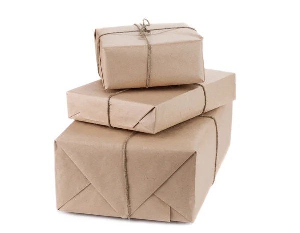 Parcel wrapped with brown kraft paper isolated on white backgrou — Stock Photo, Image