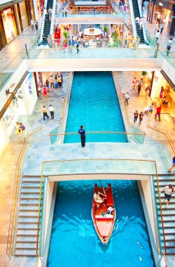 SINGAPORE - MARCH 08, 2013 : Shopping mall at Marina Bay Sands Resort in Singapore. It is billed as the world's most expensive standalone casino property at 8 billion dollars stock vector