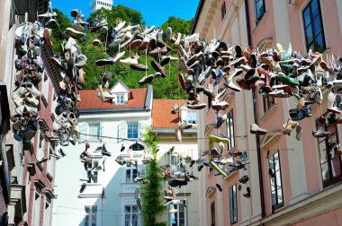 Hanging shoes, Ljubljana clipart