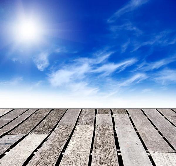 Blue sky and wood floor background Stock Photo