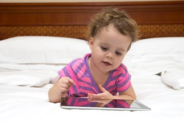 Baby with touch pad — Stock Photo, Image